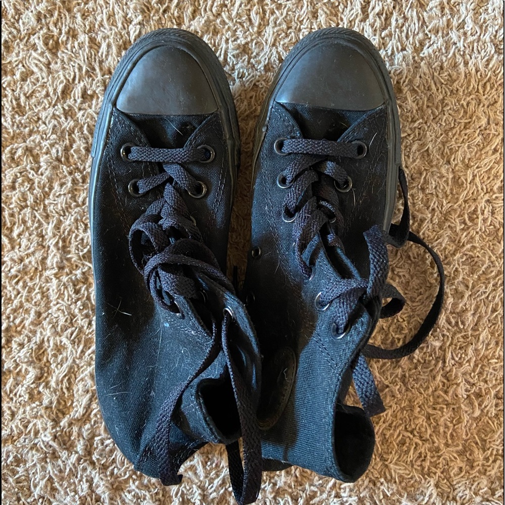 Women size 6. Men size 4. Black high top converse